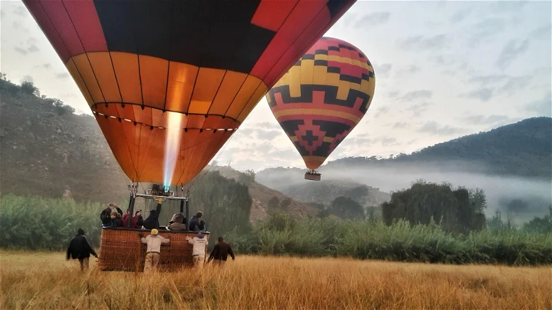 Balloons inflating before a dawn flight
